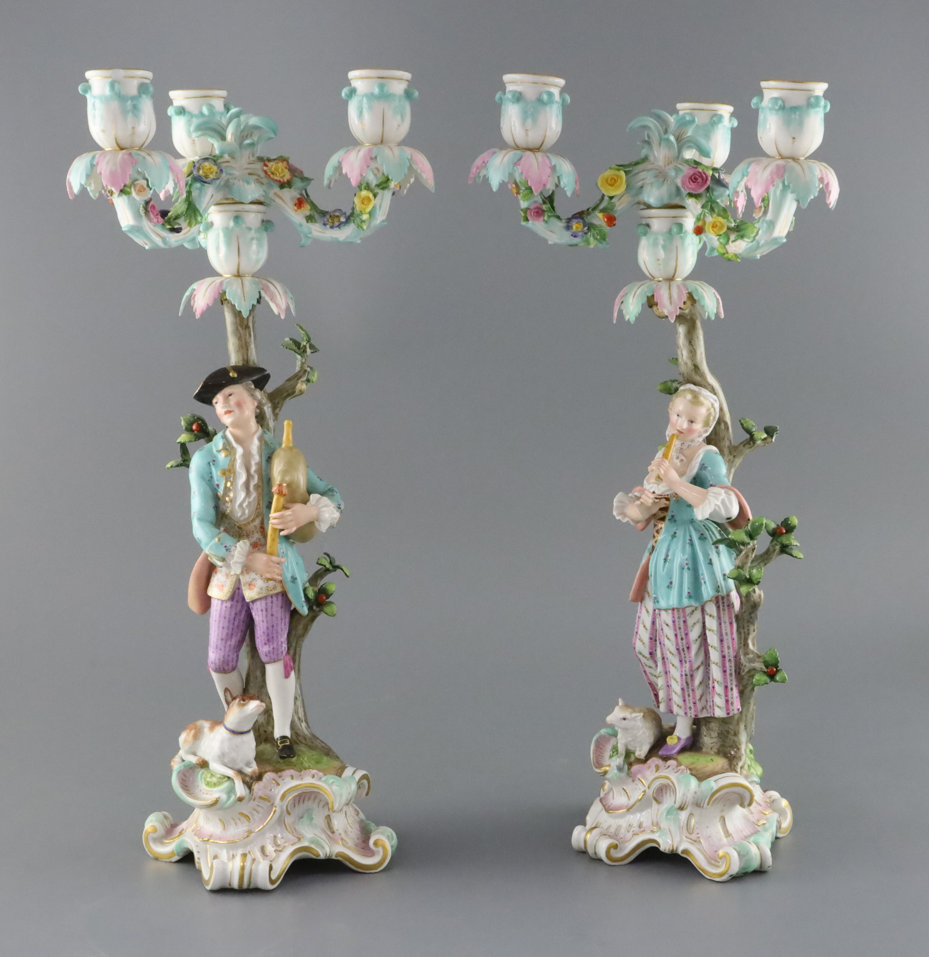 A pair of Meissen bucolic figural candelabra, 19th century, H. 42cm